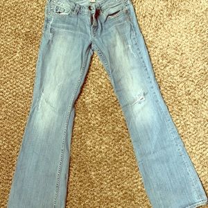 Silver size 30 distressed jean with flare bottom